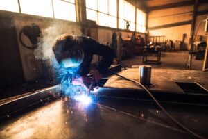 professional welder protective uniform helmet welding metal part workshop1